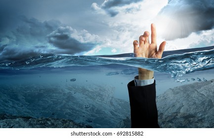 Hand Of Person Drowning In Water