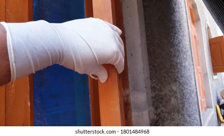 Hand Of A Person On Window Iron Roads. Sign Of Lockdown During Coronavirus Through Out The World. World Health Organisation Says To Be In Home. 