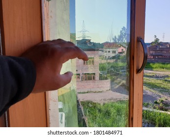 Hand Of A Person On Window Iron Roads. Sign Of Lockdown During Coronavirus Through Out The World. World Health Organisation Says To Be In Home. 