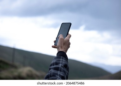 Hand With A Phone Searching For Signal 