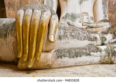 The hand of Phra Atchana, the big image of Buddha, in Sri Chum temple, the Sukhothai Historic Park, Thailand