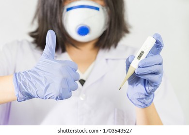 The Hand Of A Physician Is Holding Digital Thermometers To Measure Fever. The Viral Outbreak Surveillance Infective Or Infectious Concept With White Background.