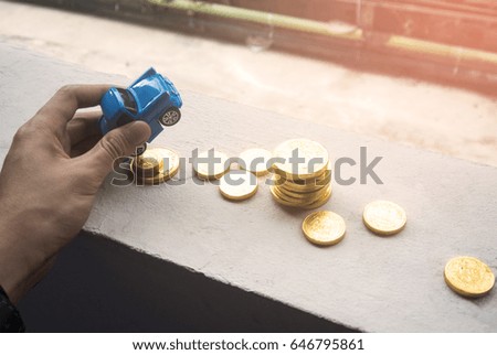 hand pick blue car and money