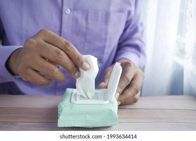 Hand Pick Cleansing Wet Wipes On Table With Copy Space 