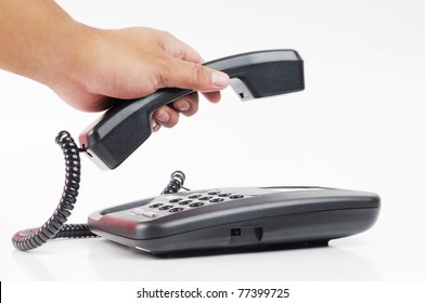 A Hand Pick Up A Phone With Isolated White Background