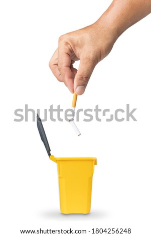 The hand picked up the broken cigarette to throw it into the trash, Broken cigarette in hand close-up, Stop smoking initiative concept of breaking cigarettes, World no tobacco day.