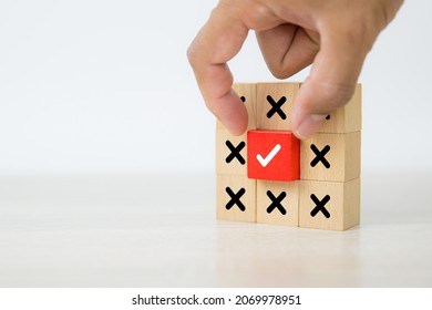 Hand Picked Check Mark On Cube Wooden Toy Block Stacked With Cross Symbol For True Or False Changing Mindset Or Way Of Adapting To Change Leader And Transform Quiz Answer And Poll Concept.