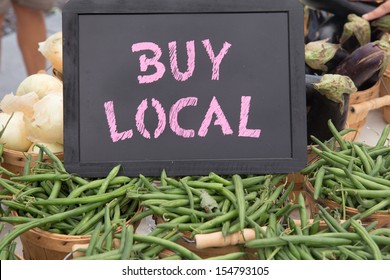 Hand Picked Green Beans, Onions and Egg Plant in Brown Basket With Buy Local Chalkboard Sign