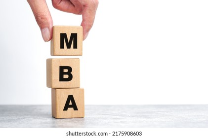 Hand Picked Wooden Blocks With The Word MBA - Master Of Business Administration. Degree Of Professionalism In Business Management. Accounting, Human Resources, Applied Statistics, Communication, 