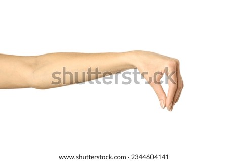 Hand picking, holding, grabbing or reaching. Woman hand with french manicure gesturing isolated on white background. Part of series [[stock_photo]] © 