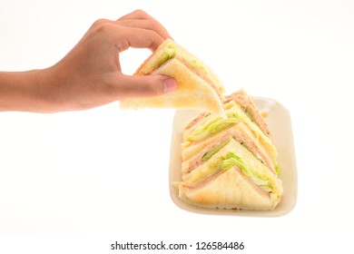 Hand Picking Up Sandwich