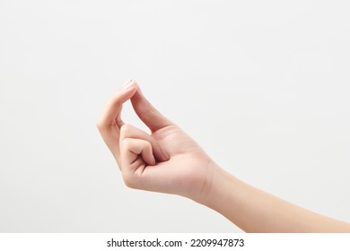 Hand Picking Up Something Like A Paper On White Background