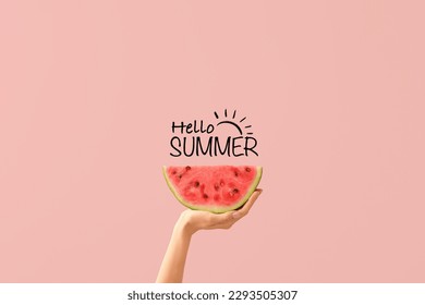 Hand with piece of ripe watermelon and text HELLO, SUMMER on pink background - Shutterstock ID 2293505307