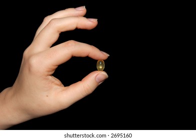 Hand with a pill