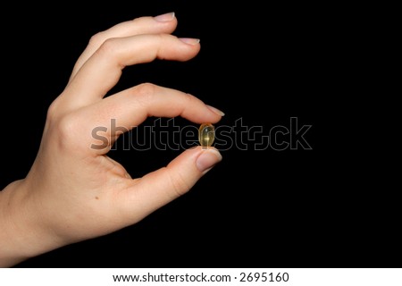 Hand with a pill