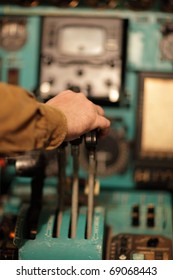 The Hand Of Pilot On Handle Of Throttle In The Airliner