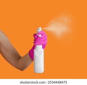 Hand in pink glove sprays detergent on orange background. Banner with copy space. Cleaning agents - Powered by Shutterstock