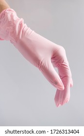 
Hand In A Pink Glove. Variation Of Latex Gloves, Rubber Gloves Production, Human Hand Wears Medical Gloves.