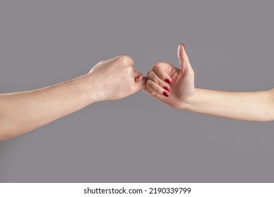 Hand To Pinky Swear,Happy Couple Or Friendship Holding Hands Together Forever. Finger Two Hands Hold Together. Show Friendship And Forgiveness. Man And Woman Do Pinky Promise Or Pinky Swear Hands.