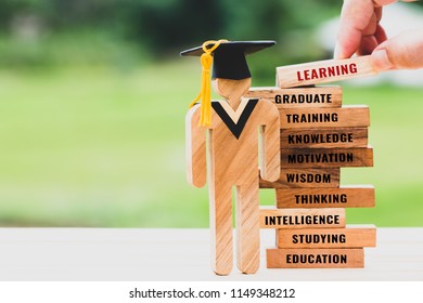 hand placing Student Sign wood with Graduation cap on wooden blocks tower. Space for letter e.g education, graduate, learning, motivation, studying etc. Ideas study to success. Back to School