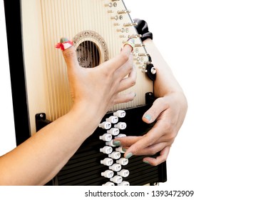 A Hand Playing A Autoharp