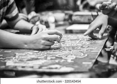 Hand Playing Board Game, Strategy Concept. Black And White Filter