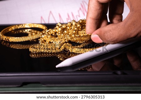 Hand Pledging Gold Bangles for Loan Amid Inflation, Rising Gold Prices and Middle Class Financial Pressure
