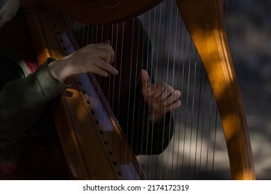 Hand Plucking The Harp Strings