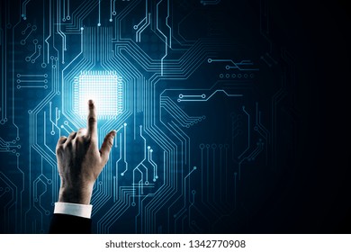 Hand pointing at creative circuit background with chip. AI and technology concept