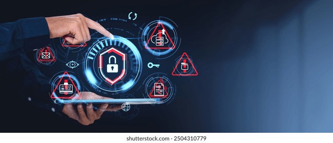 A hand pointing at cybersecurity icons on a virtual interface with a tablet, on a dark background. Concept of cyber security and digital protection - Powered by Shutterstock