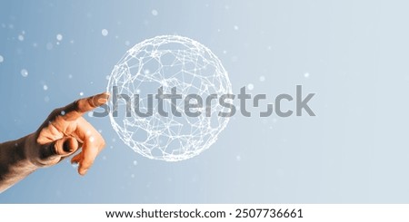 Hand pointing at a digital wireframe globe on a light blue background. It represents global connections, technology, and network concepts