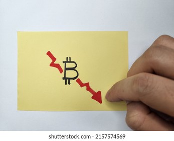 Hand Pointing At A Downward Graph Depicting Bitcoin Plunge