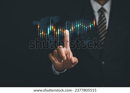 Hand pointing finger towards stock market graph, planning and strategizing for profitable trading. Technical analysis, candlestick chart, and investment strategy concept on digital screen background.
