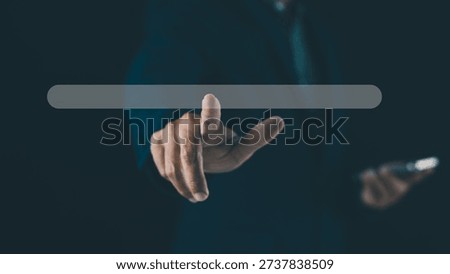 A hand is pointing forward, interacting with a virtual search bar interface against a dark background, symbolizing digital technology and user interaction.