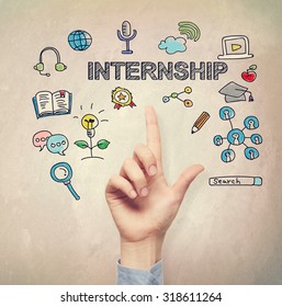 Hand Pointing To Internship Concept On Light Brown Wall Background