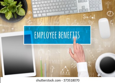 Hand Pointing On Employee Benefits And In The Blurry Background Tools At Work