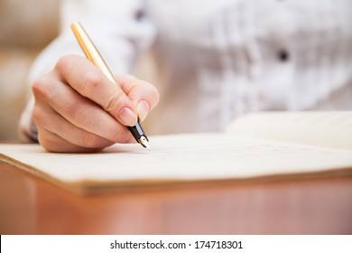  Hand Pointing With Pen To Music Book With Handwritten Notes