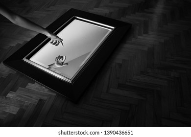 hand pointing reflecting in a mirror
 - Shutterstock ID 1390436651