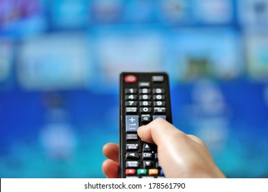 Hand Pointing Tv Remote Control And Tv Set