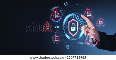Hand pointing at various digital security icons, emphasizing cybersecurity. Dark background. Concept of data protection and risk management