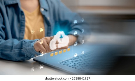 Hand pointing at a virtual cloud icon with file folders, symbolizing cloud computing, data storage, online backup, and digital document management on a laptop.
