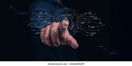 A hand points to a digital interface displaying data connections and icons, symbolizing technology and data management.
