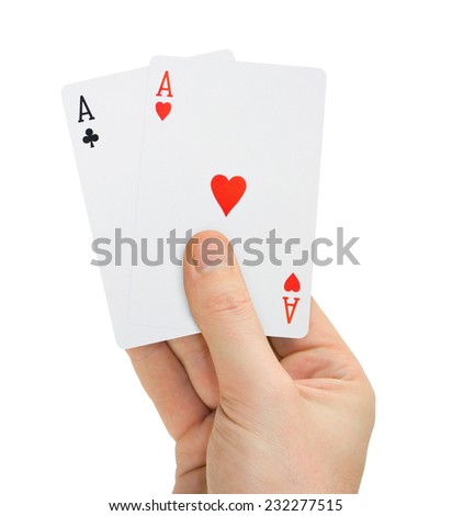 Hand with poker cards isolated on white background