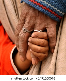 Hand Of Poor Mother With Doughter In South America