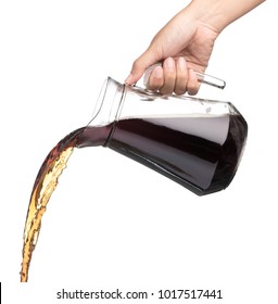 Hand Pouring Cola In A Jug Isolated On A White Background 