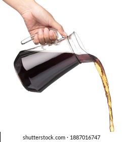 Hand Pouring Cola In A Jug Isolated On A White Background 