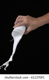 Hand Pouring Glass Of The Milk