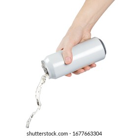 Hand Pouring Some Liquid Out Of White Aluminium Can, Isolated On White Background