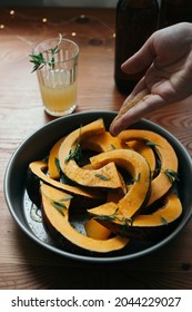 Hand Pouring Sugar On The Raw Pumpkin