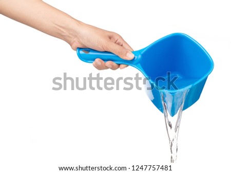 hand pouring water from A plastic bowl bath isolated on white background